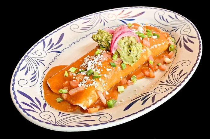 Expresso Burrito under enchilada sauce with guacamole