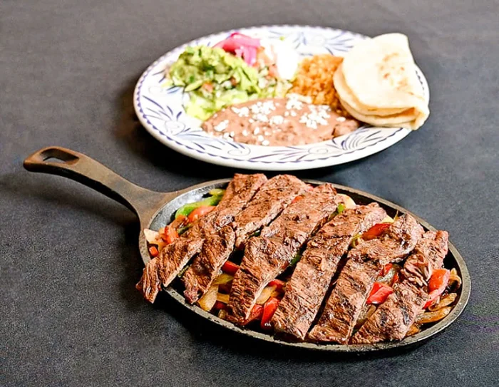 Las Fajitas platter with sizzling skirt steak